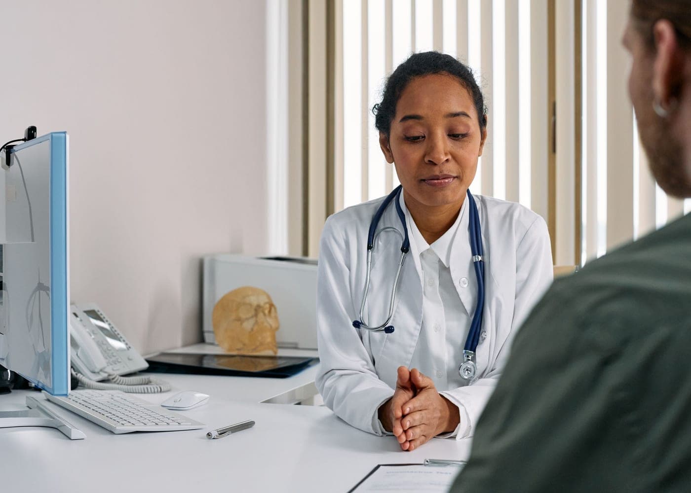 Doctor talking with a patient in a modern practice office