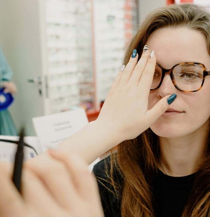 Patient being fitted for glasses at an eye exam